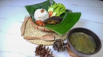 spleen food on a banana leaf with a classic and traditional theme photo