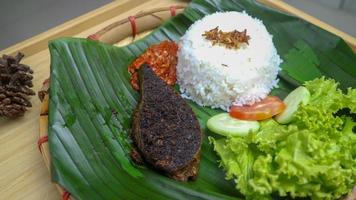 spleen food on a banana leaf with a classic and traditional theme photo