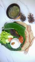 spleen food on a banana leaf with a classic and traditional theme photo