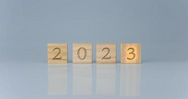 Wooden blocks lined up with the letters 2023. Represents the goal setting for 2023, the concept of a start. financial planning development strategy business goal setting photo