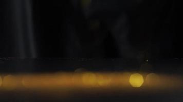 Abstract golden texture in blurry light for background animation. Glitter pattern for video effect, transition and overlay