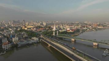 Aerial view of Phra Buddha Yodfa Bridge, Memorial Bridge and Phra Pok Klao Bridge over the Chaophraya River at sunrise scene, Bangkok City, Thailand video