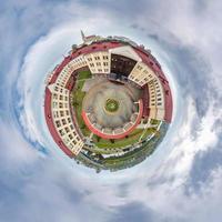 little planet and spherical aerial 360 panorama view on street ancient medieval castle with church and historic buildings with columns photo