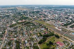 aerial panoramic view from great height of provincial town with a private sector and high-rise urban apartment buildings photo
