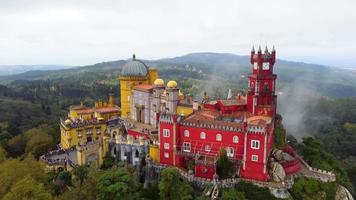 Aerial drone view of Park and National Palace of Pena in Sintra, Portugal during a magical day. Unesco. Historic visits. Sightseeing. Fairytale. Best destinations in the world. Most visited places. video