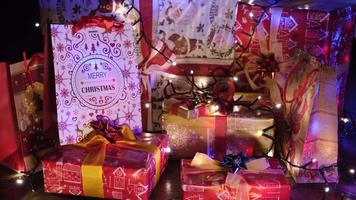 Colorful Gifts under the Pine Tree at Christmas Eve night in a cozy winter home living room video