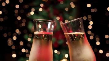 Champagne flute cheers toasting for Christmas Eve dinner video