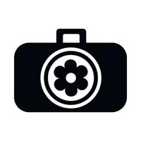 Photo camera with flower in the lens icon vector