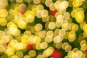 Abstract blurred christmas tree with bokeh light background photo