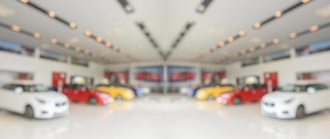 new cars in showroom interior blurred abstract background photo