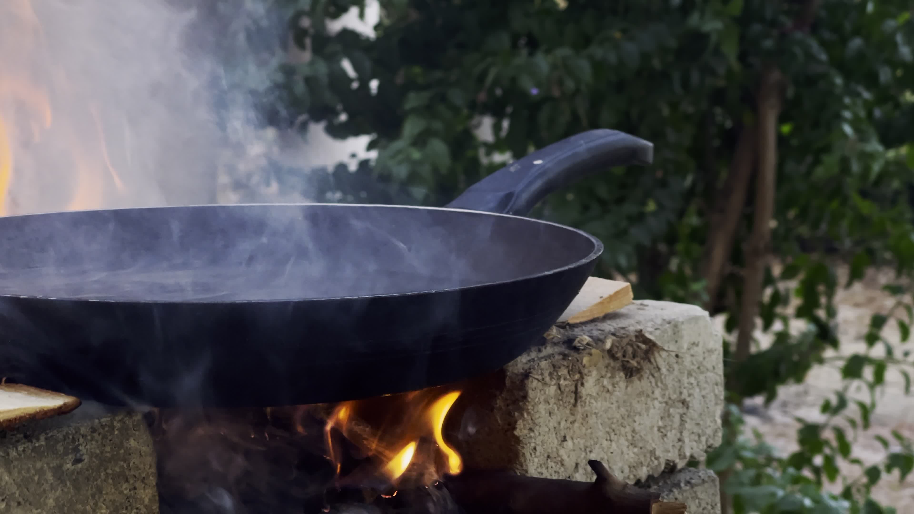 Wood Fire and Heated Pan 14590320 Stock Video at Vecteezy