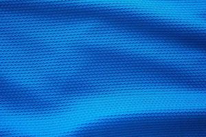 Camiseta de fútbol azul ropa textura de tela ropa deportiva fondo, vista superior de primer plano