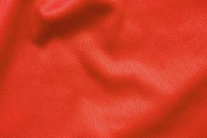 Red sports clothing fabric football shirt jersey texture background photo