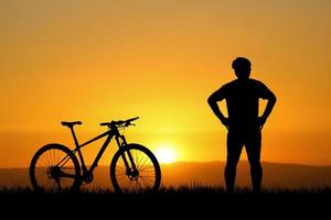 Silhouettes of bikes and cyclists travel concept and exercise by bicycle photo