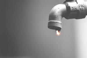 A faucet where the water does not flow. The concept of water scarcity and the water crisis photo