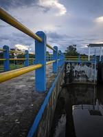 irrigation dam with flowing water photo