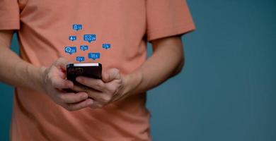 Man hand using smartphone with Social media concept. photo