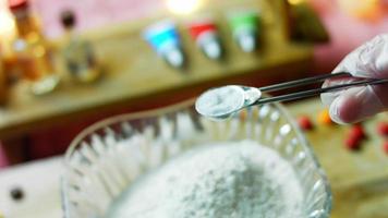 Mix the cake ingredients with the mixer. The baby is sitting in a chair and enjoying himself video