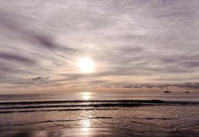 Sunset over the ocean photo