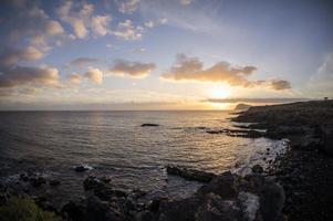 Sunset over the ocean photo