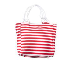 Summer accessories summer bag iwith a red stripe solated on white background. photo