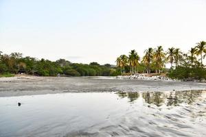 Beach reflection in the evening photo