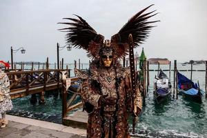 Unidentified people wearing carnival masks at the Venice Carnival in Venice, Italy, circa February 2022 photo