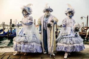 Unidentified people wearing carnival masks at the Venice Carnival in Venice, Italy, circa February 2022 photo