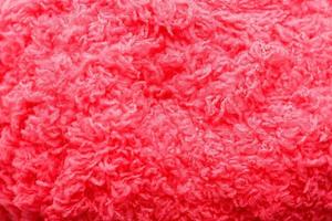 Wool yarn close-up colorful pink thread for needlework in macro photo