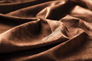 Brown velor textural background pattern. Gorgeous elastic velor fabric has a velvet pile, shine and texture. photo