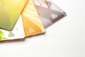 Credit cards with contactless payment. Pile of credit cards on white isolated background photo