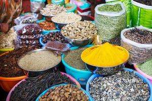 Indian colored spices at local market. A variety of spices of different colors and shades, flavors and textures on the stalls of the Indian market photo