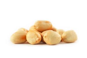 Roasted peanuts peeled and isolated on a white background photo