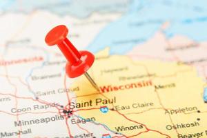 Red clerical needle on a map of USA, Wisconsin and the capital Madison. Close up map of Wisconsin with red tack photo