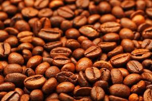 granos de café tostados frescos y aromáticos, se pueden utilizar como fondo. foto