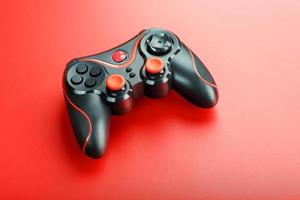 Game controller controller on red background. Device to control and control the game. photo