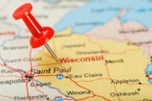 Red clerical needle on a map of USA, Wisconsin and the capital Madison. Close up map of Wisconsin with red tack photo