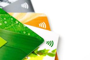 Credit cards with contactless payment. Pile of credit cards on white isolated background photo