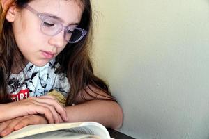 Young School Girl Studying her Lesson photo