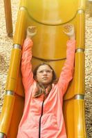 Teenage Girl is Having Fun in the Playground photo