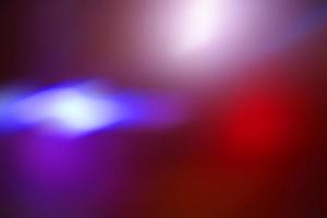 Defocus blurred abstract colorful gradient spotlight floor texture background. Dark purple with shining background. photo