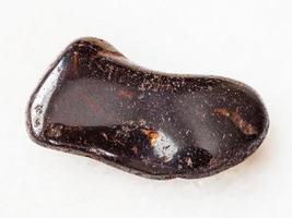 tumbled hydrogoethite gemstone on white photo