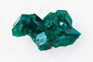 raw Dioptase crystal of gemstone on white photo