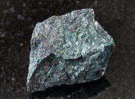 unpolished Magnetite ore on black photo
