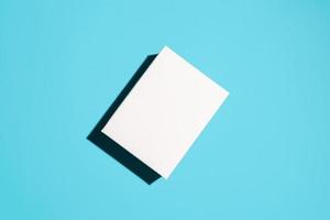 White cardboard box mock up. Top view, blue background. Place for logo, advertising. Delivery concept photo