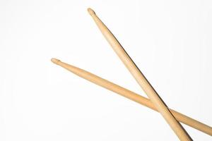 Drum sticks on white background, top view photo