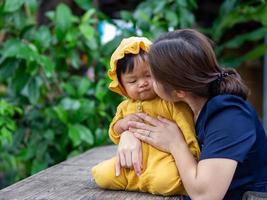 Asian mother and son of Thai nationality and nature at De mala Cafe, Thung Saliam, Sukhothai, Thailand. photo