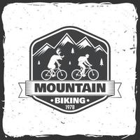 Vintage typography design with man riding bike and mountain silhouette. vector