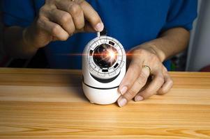 Conceptual man operating ip camera photo