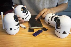 Conceptual man operating ip camera photo